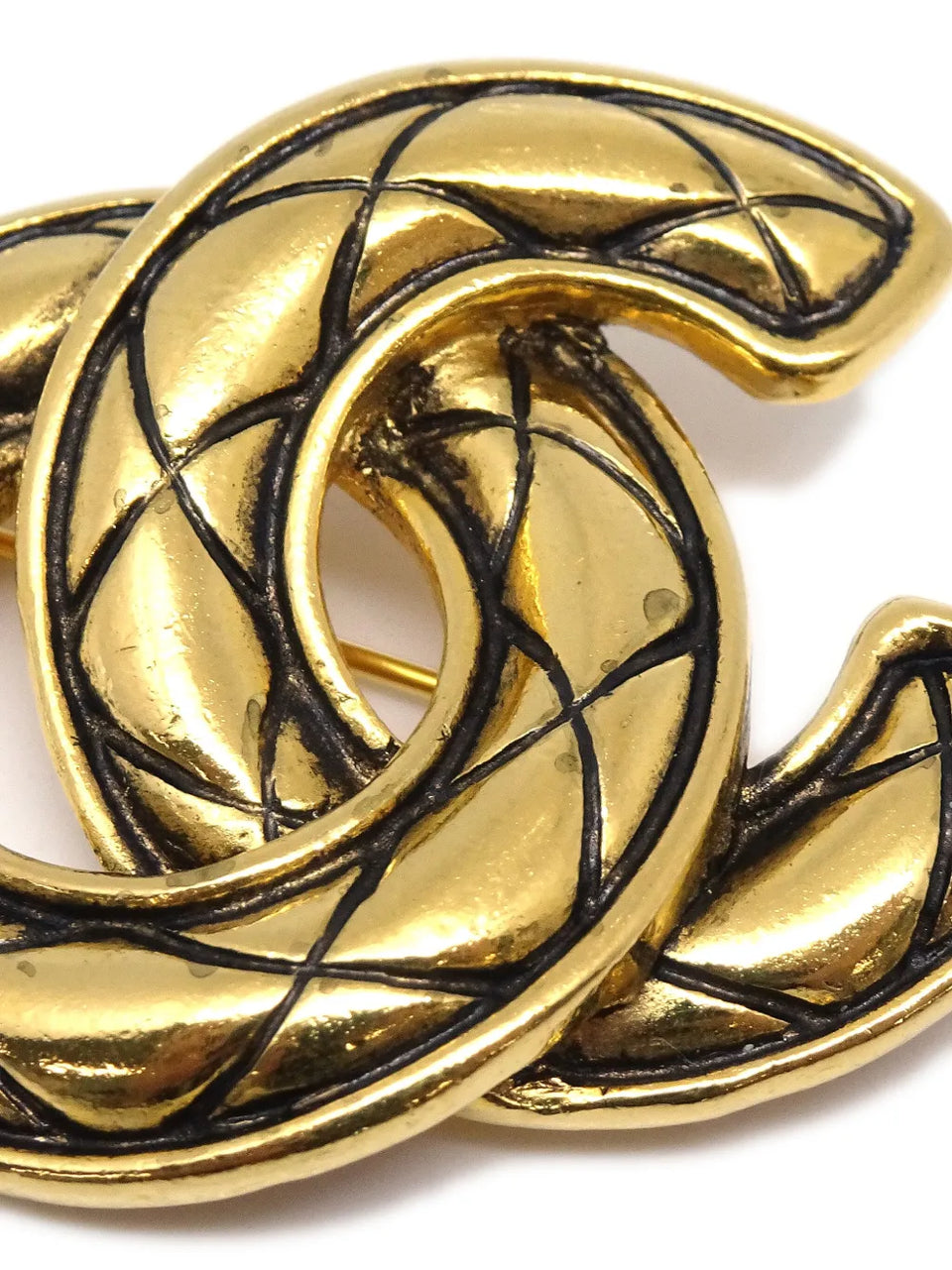 1980-1986 CC diamond-quilted brooch