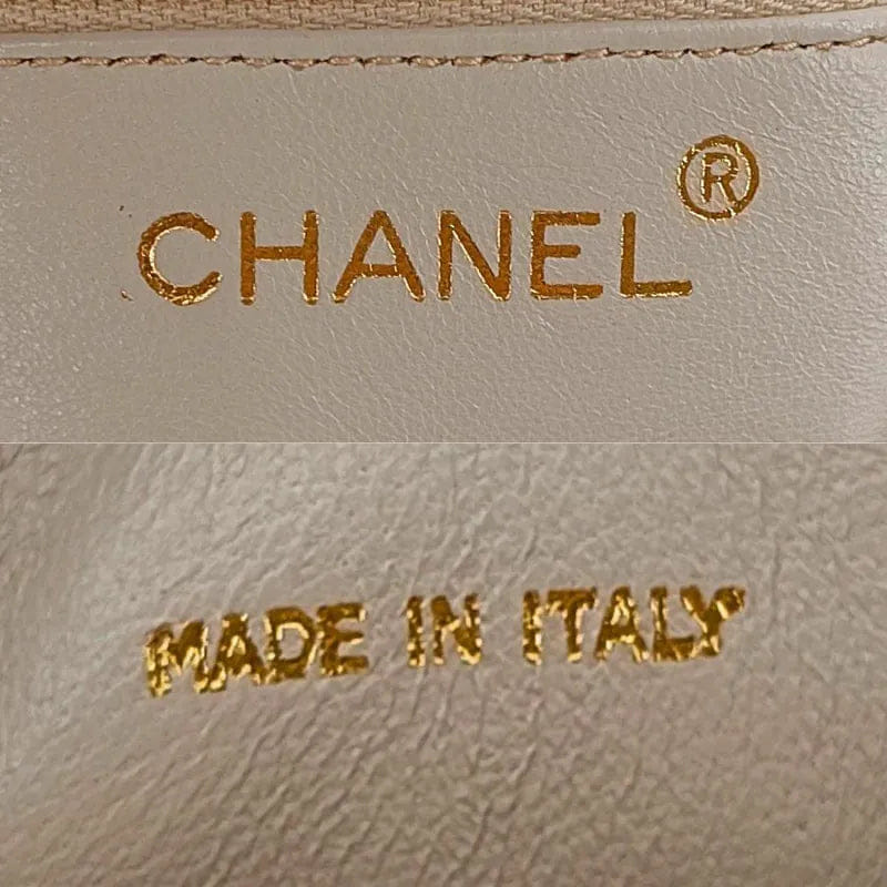 RA862 - CHANEL Vintage Beige Lambskin Tassel Camera Bag