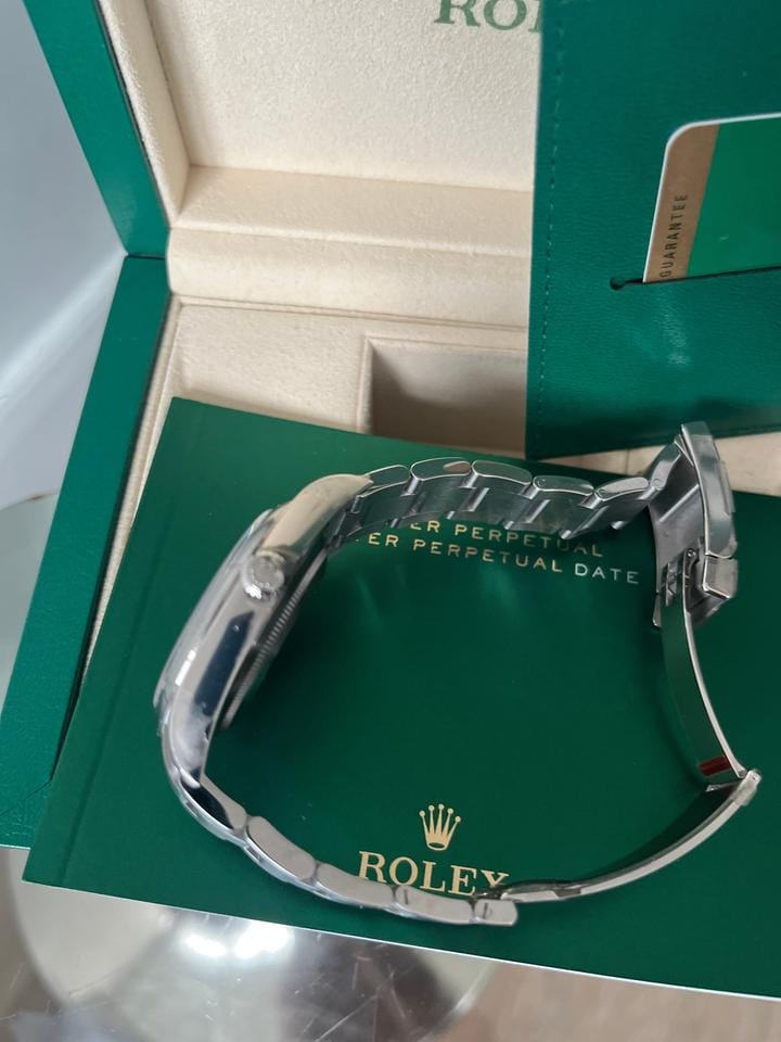 Rolex Oyster Perpetual Fully factory stickered with original box and paper work.