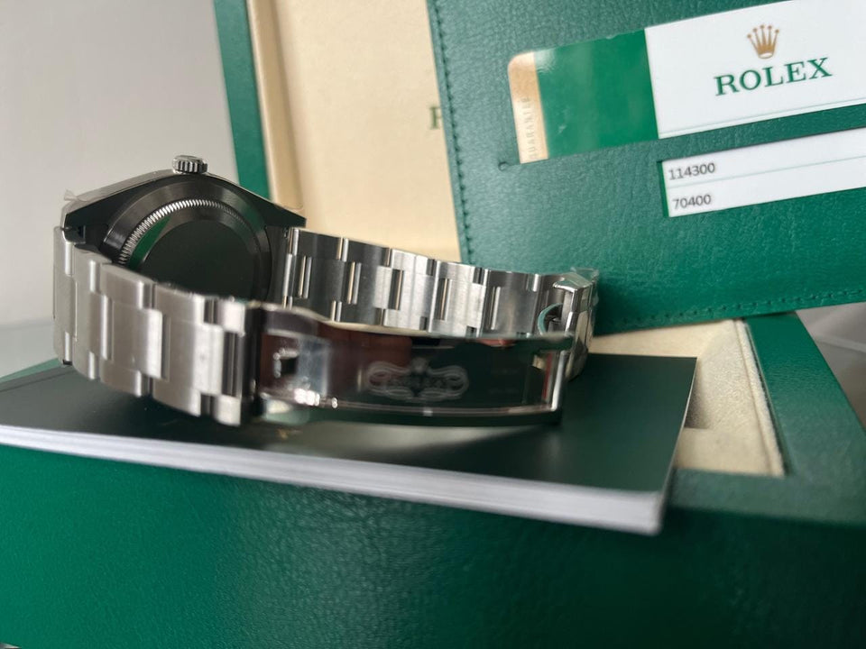 Rolex Oyster Perpetual Fully factory stickered with original box and paper work.