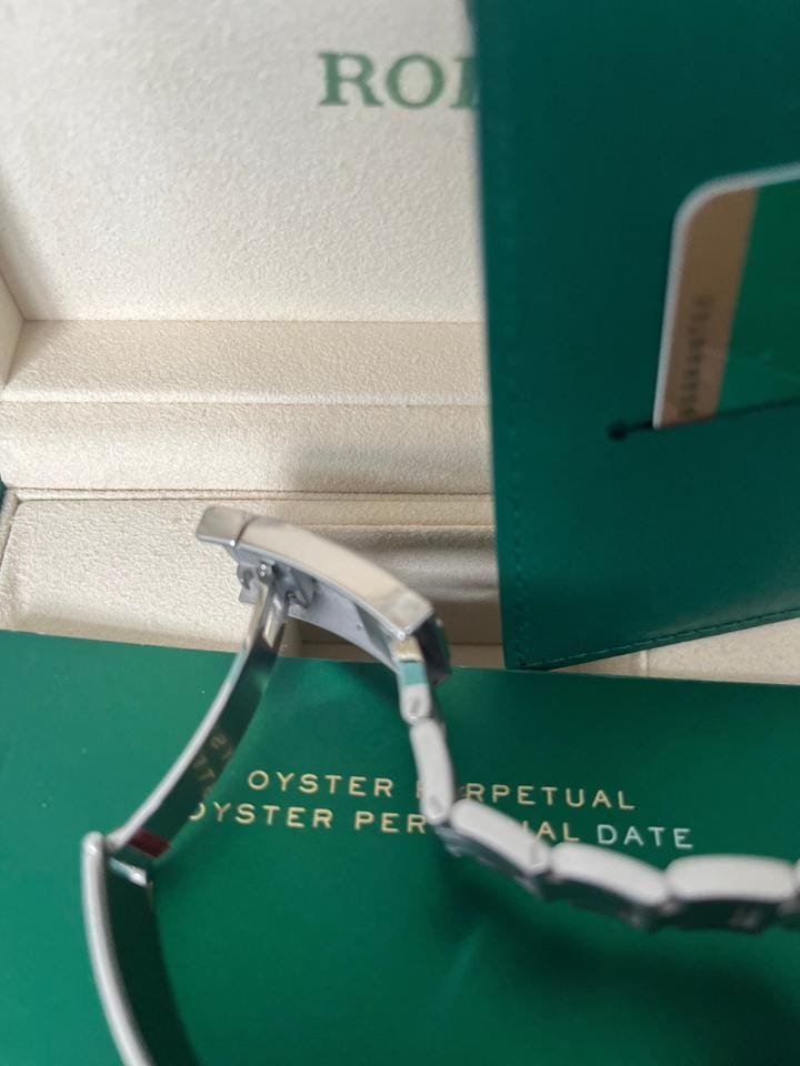 Rolex Oyster Perpetual Fully factory stickered with original box and paper work.