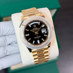 Rolex | Day-Date | 228238 | Yellow gold | 40 x 47 mm | Yellow gold | Black | Automatic