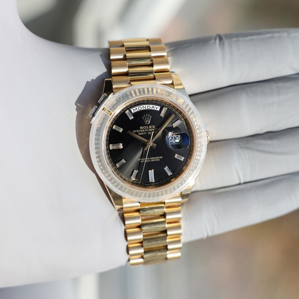 Rolex | Day-Date | 228238 | Yellow gold | 40 x 47 mm | Yellow gold | Black | Automatic