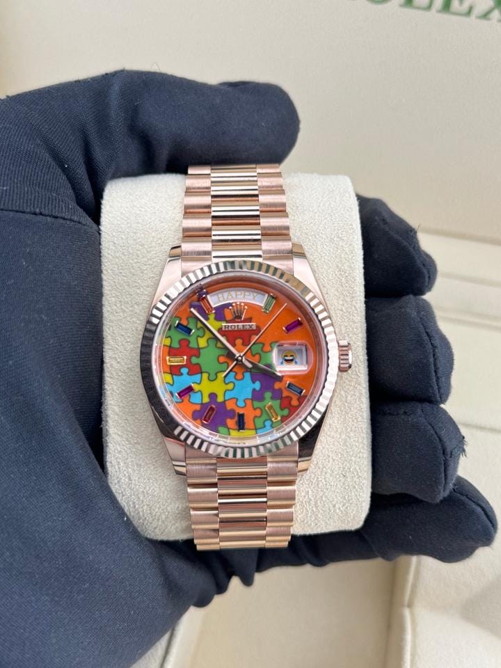 Rolex | Day-Date | 128235 | Rose gold | 36 x 43 mm | Rose gold | Orange | Automatic