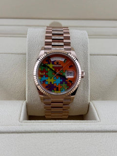 Rolex | Day-Date | 128235 | Rose gold | 36 x 43 mm | Rose gold | Orange | Automatic