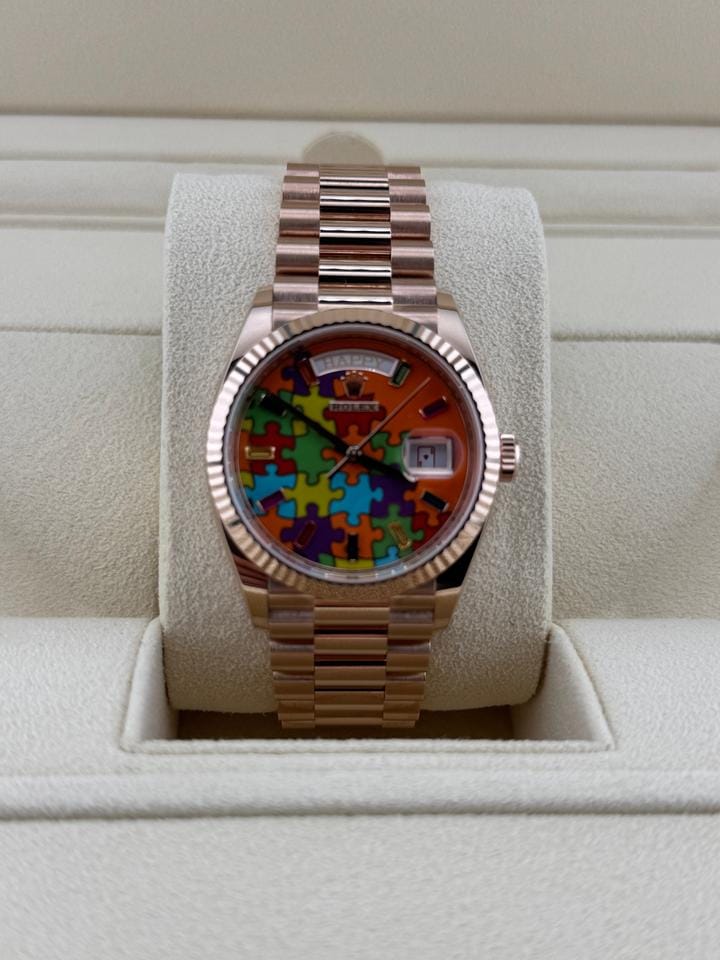 Rolex | Day-Date | 128235 | Rose gold | 36 x 43 mm | Rose gold | Orange | Automatic