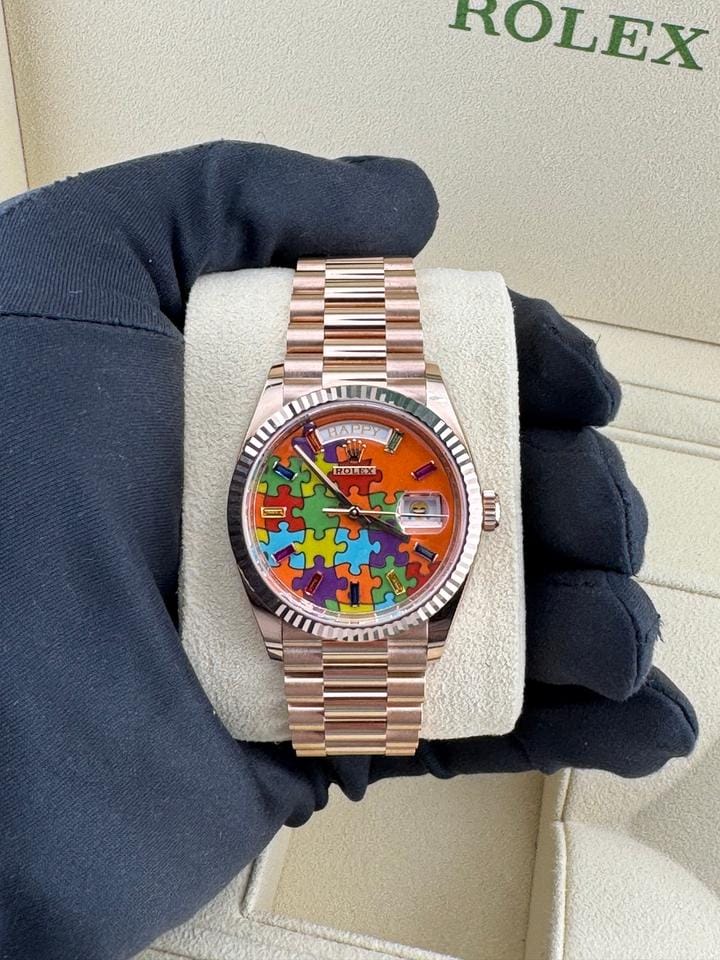 Rolex | Day-Date | 128235 | Rose gold | 36 x 43 mm | Rose gold | Orange | Automatic