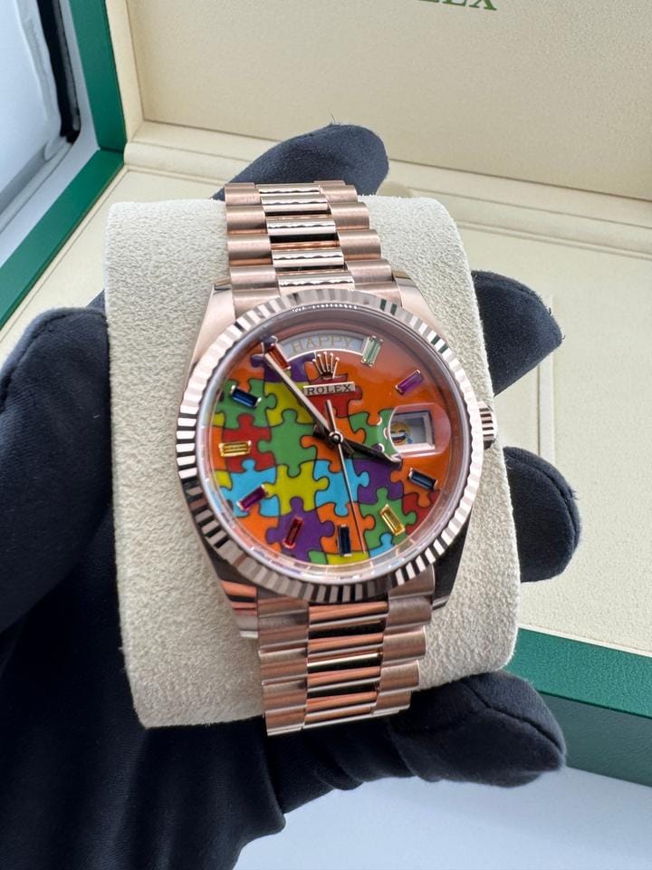 Rolex | Day-Date | 128235 | Rose gold | 36 x 43 mm | Rose gold | Orange | Automatic