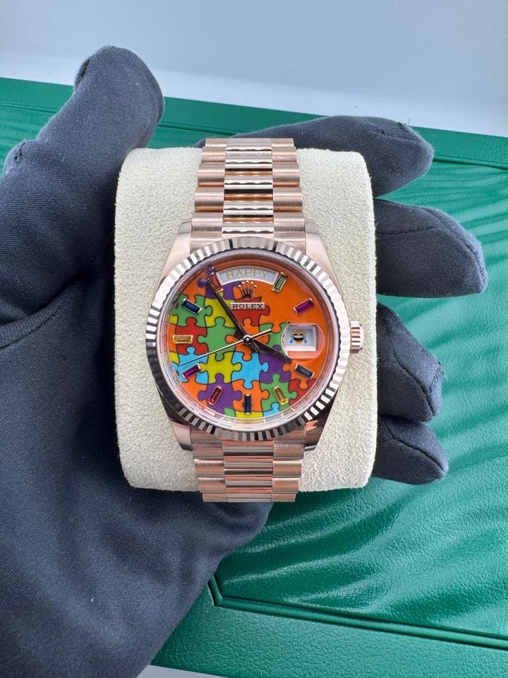 Rolex | Day-Date | 128235 | Rose gold | 36 x 43 mm | Rose gold | Orange | Automatic