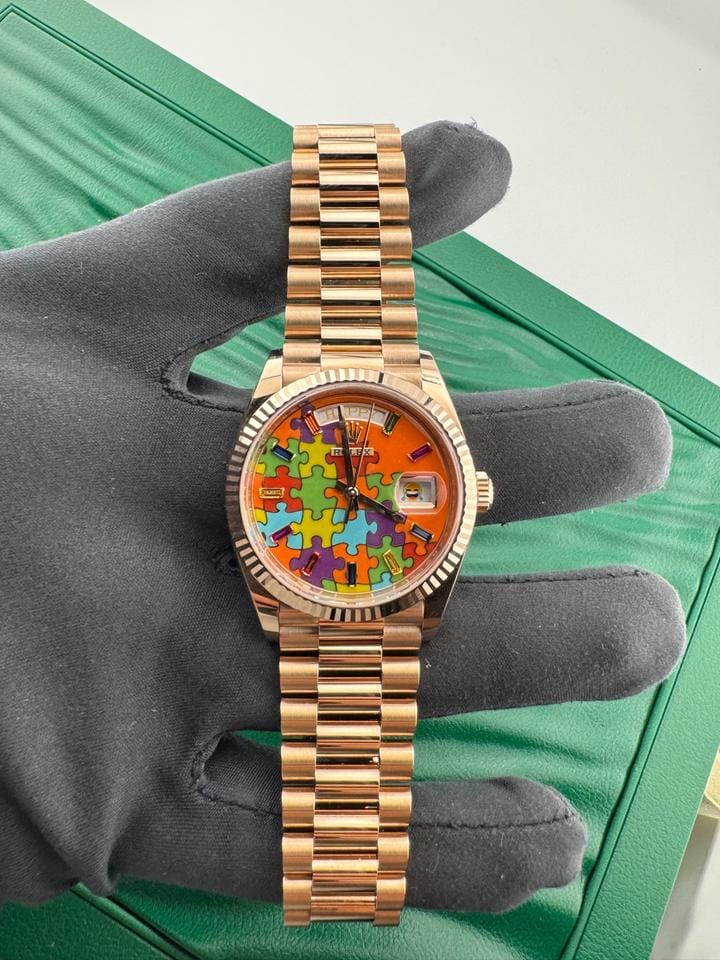 Rolex | Day-Date | 128235 | Rose gold | 36 x 43 mm | Rose gold | Orange | Automatic