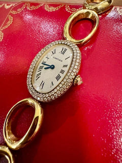 Cartier Baignoire REF.1967 AN ATTRACTIVE GOLD AND DIAMOND-SET BRACELET WATCH Rare