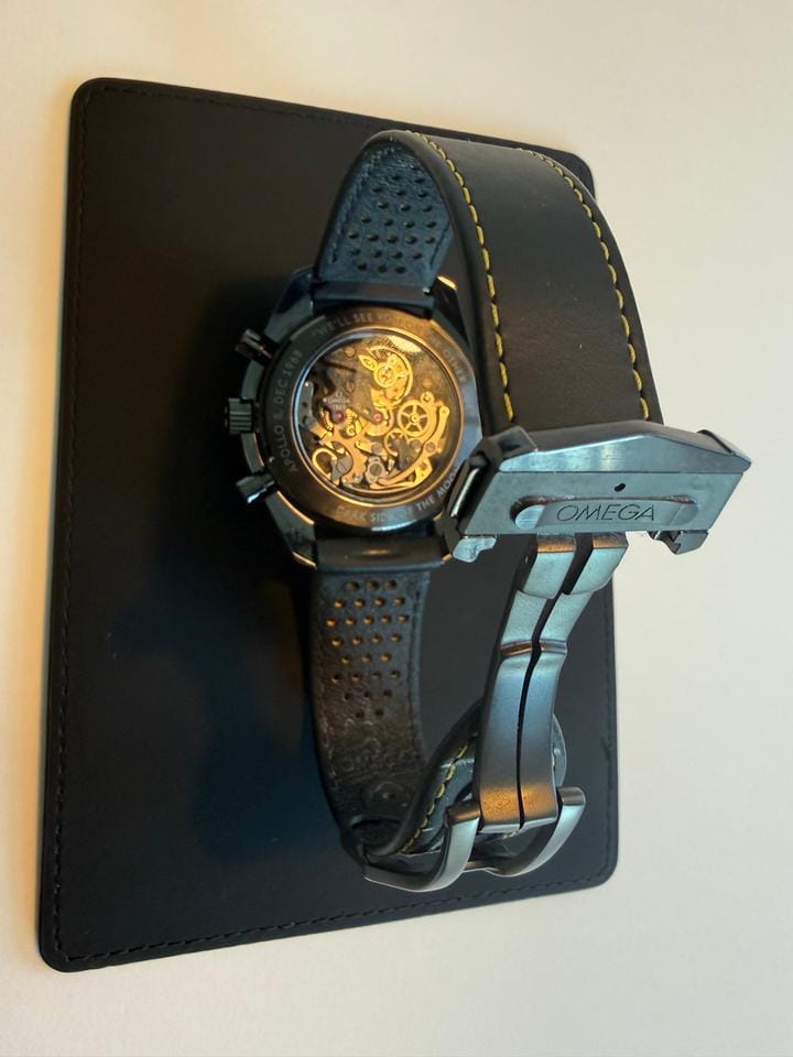Omega Speedmaster Dark Side Of The Moon Apollo 8 Special Edition with both pin buckle & fold clasp.