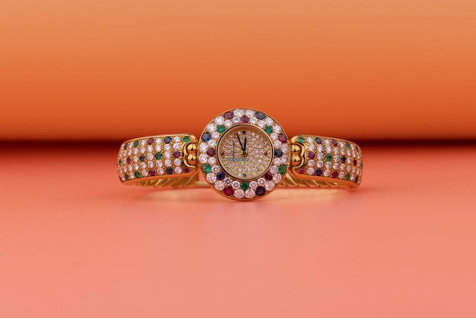 Audemars Piguet Unworn Extremely Rare Lady Wristwatch | Unique Pave Diamonds Emeralds Sapphires and Rubies | 18k Yellow Gold