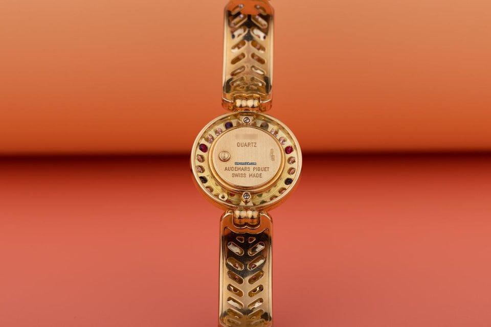 Audemars Piguet Unworn Extremely Rare Lady Wristwatch | Unique Pave Diamonds Emeralds Sapphires and Rubies | 18k Yellow Gold