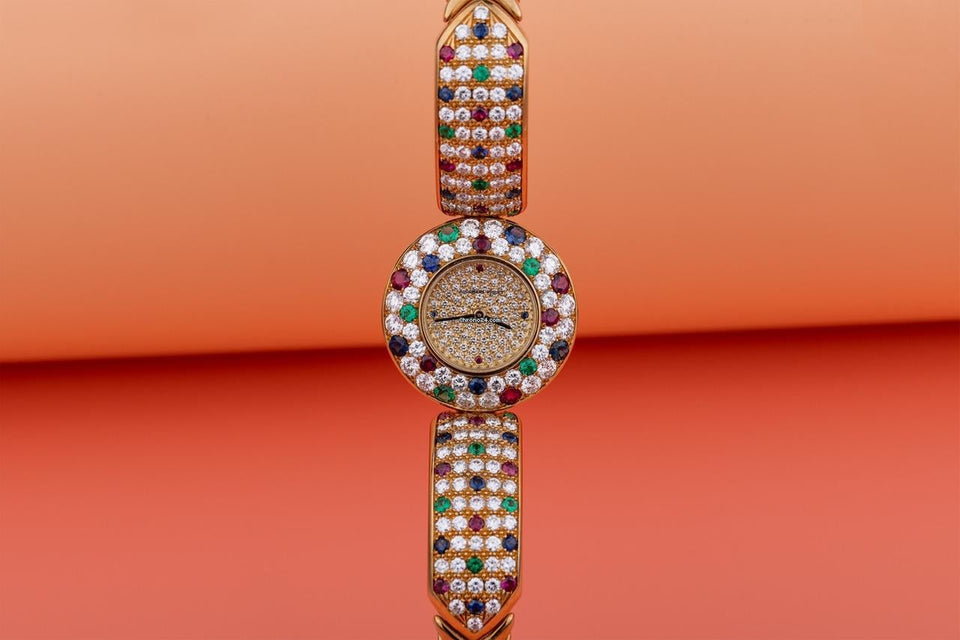 Audemars Piguet Unworn Extremely Rare Lady Wristwatch | Unique Pave Diamonds Emeralds Sapphires and Rubies | 18k Yellow Gold