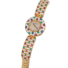 Audemars Piguet Unworn Extremely Rare Lady Wristwatch | Unique Pave Diamonds Emeralds Sapphires and Rubies | 18k Yellow Gold