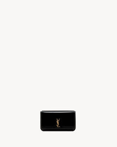 CASSANDRE phone holder IN PATENT LEATHER BLACK