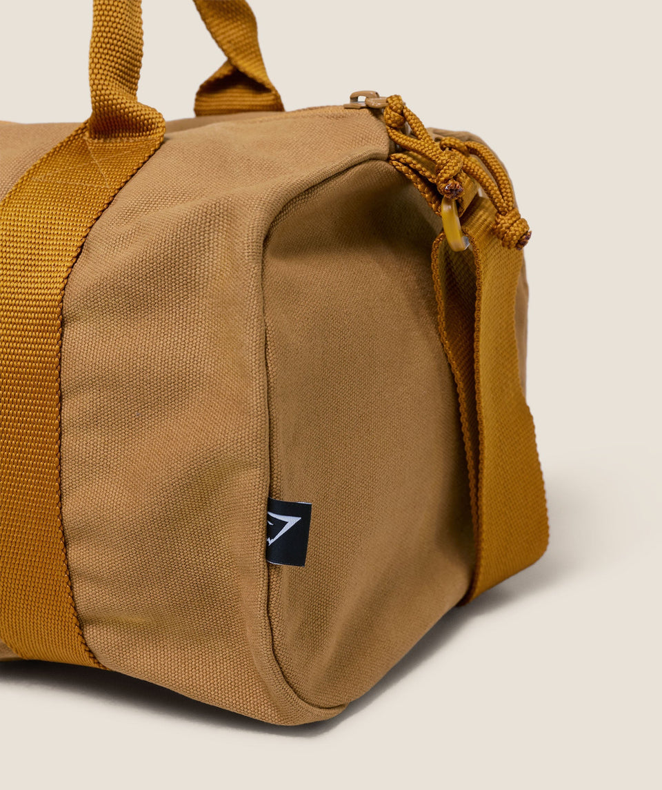 Women's Gymshark Strength Dept Mini Canvas Duffle Bag Antique Gold